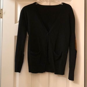 Black sweater with brown suede elbow batches